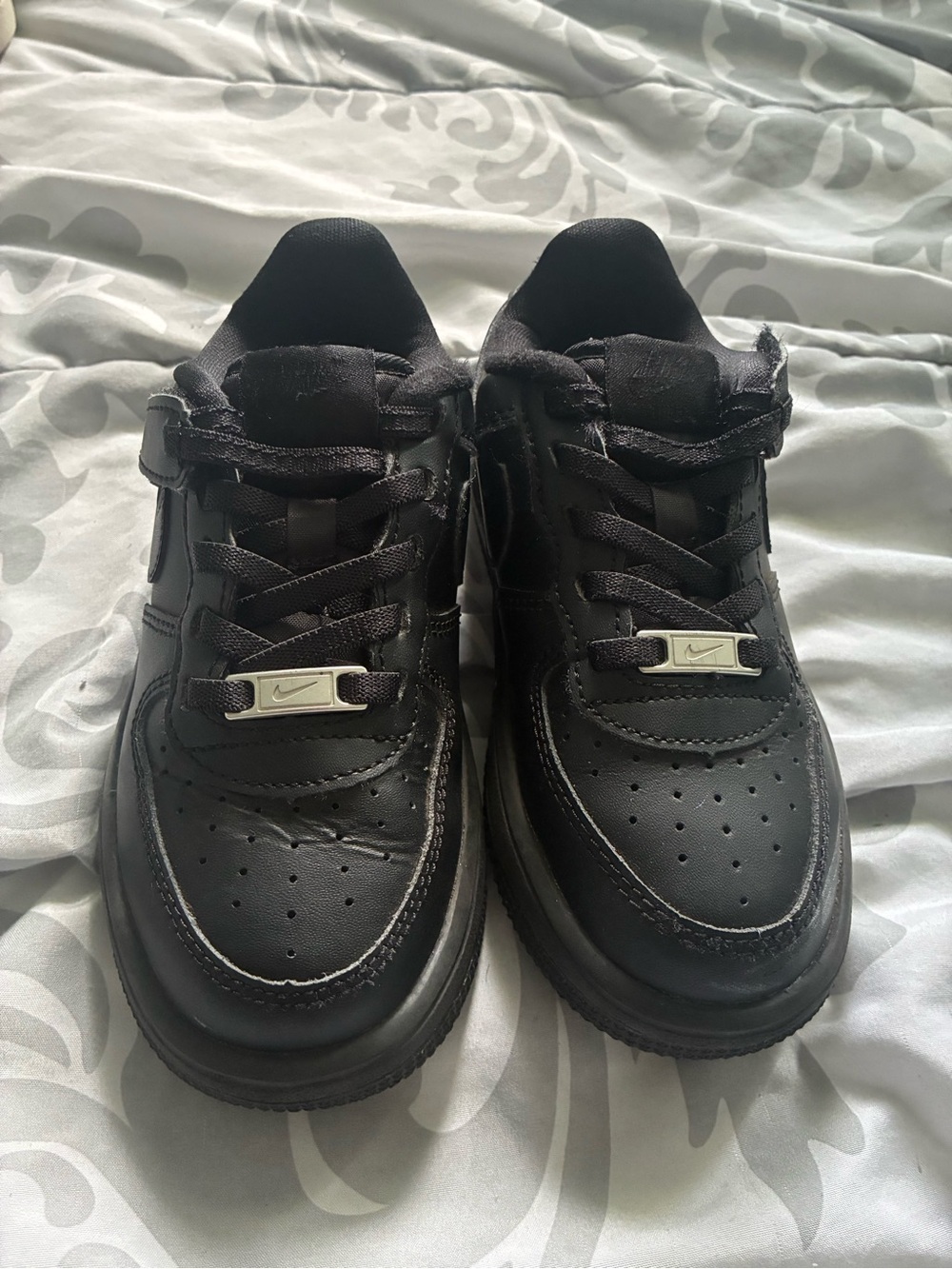 Nike Black Low-Top Leather Sneakers with Silver Lace Tags